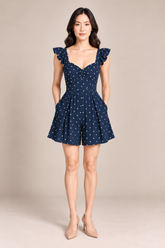 NAVY POLKA DOT ROMPER