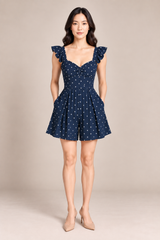 NAVY POLKA DOT ROMPER