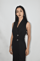 Woman in black collar overlap jumpsuit