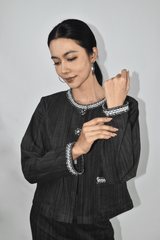 Woman wearing a black denim jacket